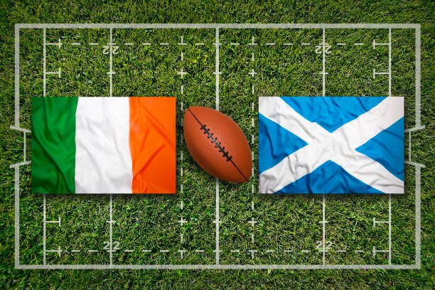 Ireland vs. Scotland flags on green rugby field